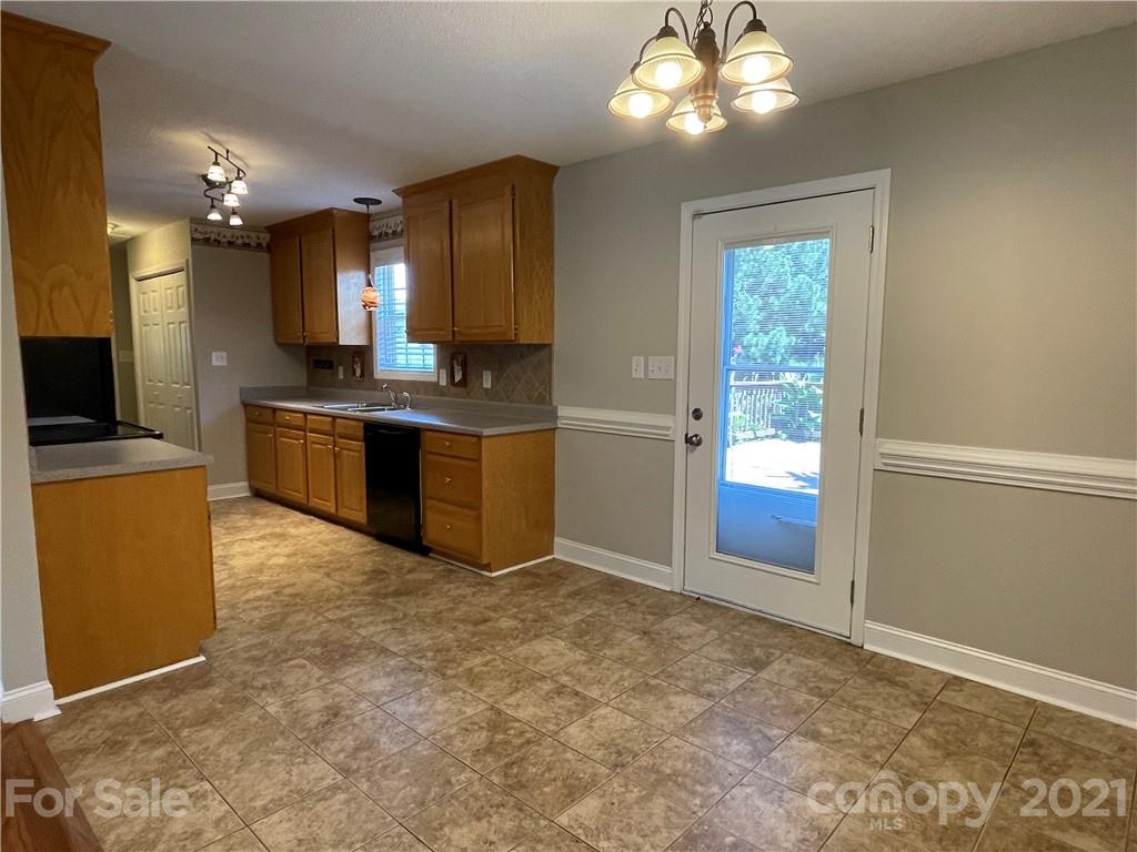 3622 Lee Moore Road Maiden, NC 28650 - Photo 6 of 34 a view of kitchen with granite countertop stove top oven and sink