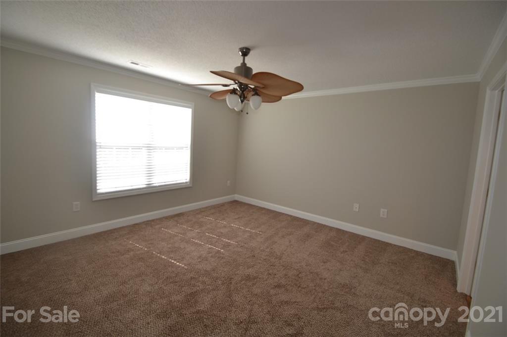 3622 Lee Moore Road Maiden, NC 28650 - Photo 10 of 34 an empty room with a window and a fan