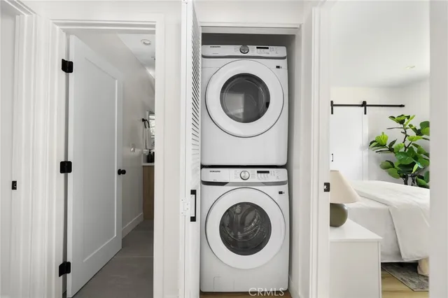 a view of a hallway with washer and dryer