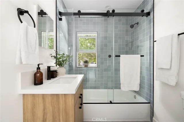 a bathroom with a shower and a sink