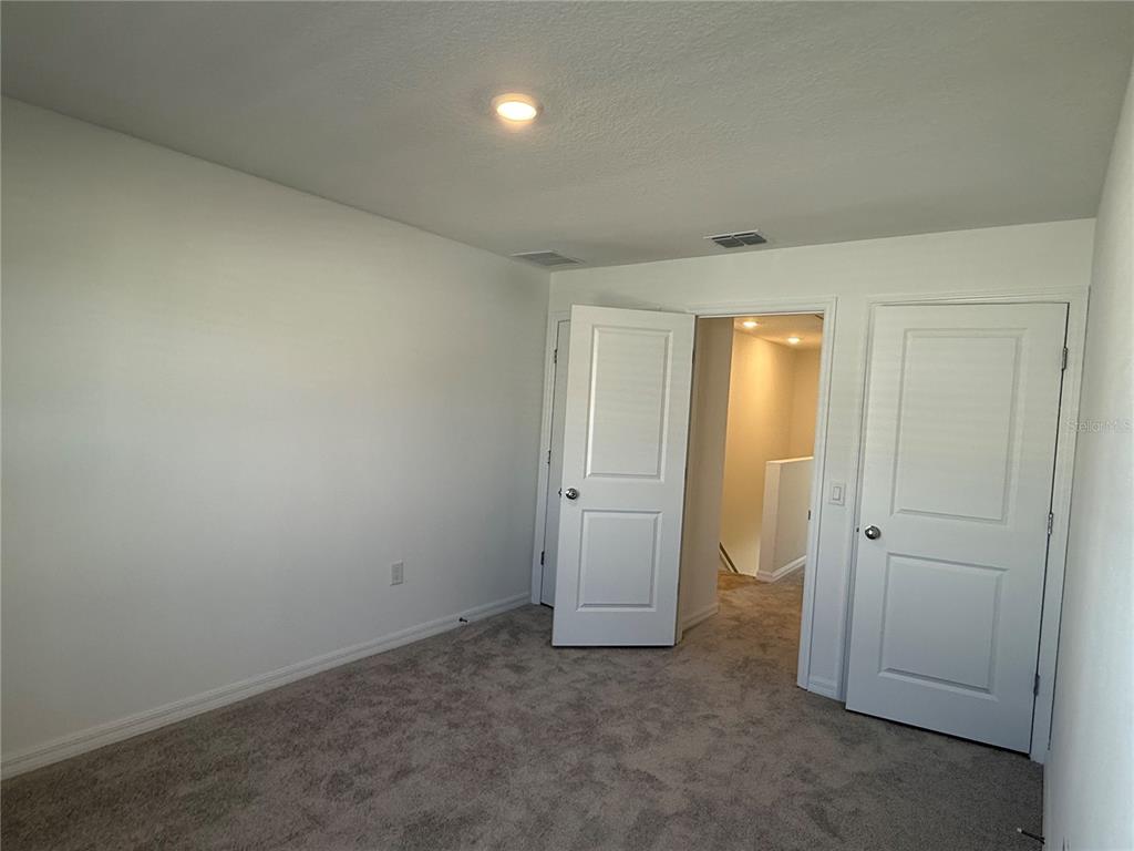 2980 Skyline Loop, Unit 2980 Kissimmee, FL 34758 - Photo 13 of 14 an empty room with closet area