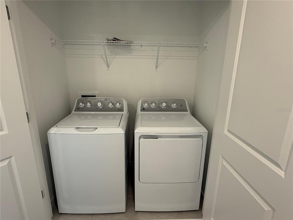 2980 Skyline Loop, Unit 2980 Kissimmee, FL 34758 - Photo 14 of 14 a utility room with dryer and washer