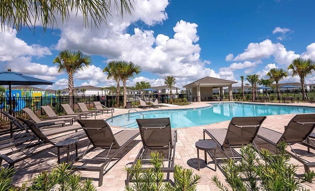 2980 Skyline Loop, Unit 2980 Kissimmee, FL 34758 - Photo 4 of 14 a view of a patio with couches table and chairs