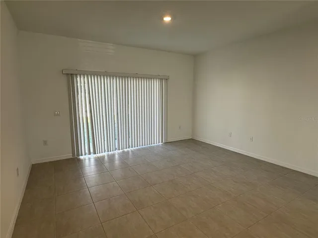 a view of kitchen with stainless steel appliances refrigerator and microwave