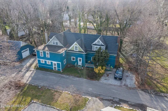 a view of house with outdoor space and sitting area