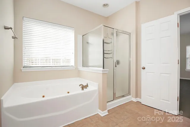 a white bath tub sitting next to a window
