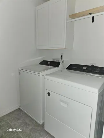 a utility room with dryer and washer