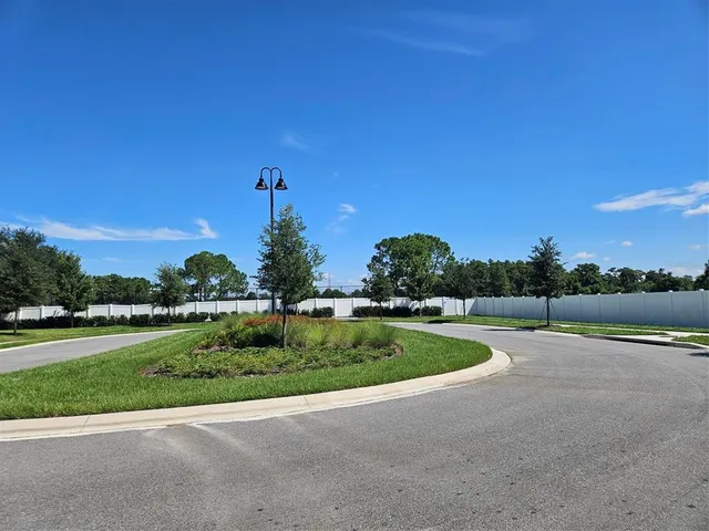 a view of a golf course with a lake view