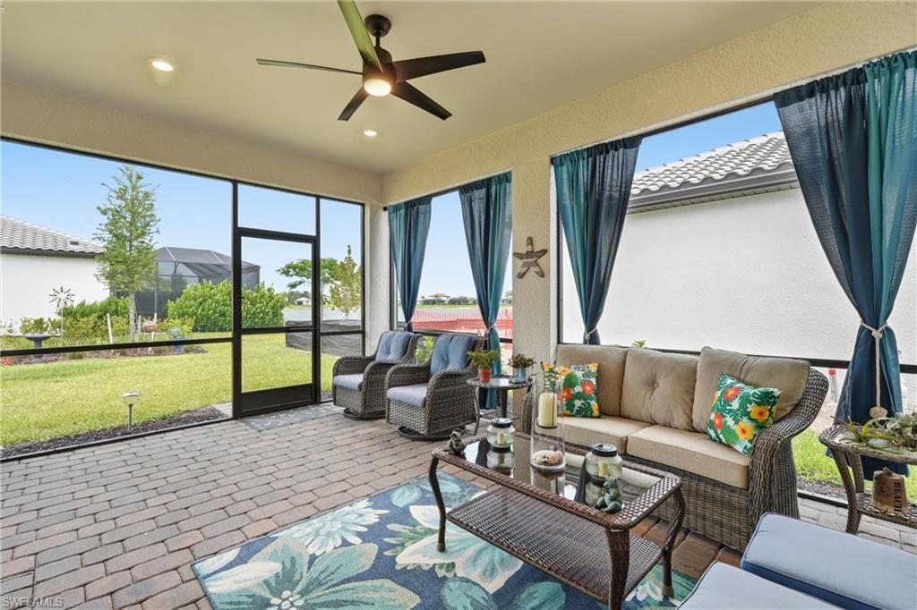 18364 Ridgeline Drive Estero, FL 33928 - Photo 37 of 50 a living room with furniture and a large window