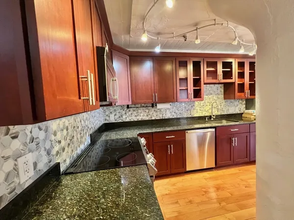 a room with furniture and wooden floor