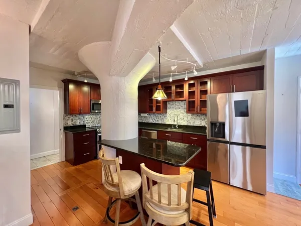 a view of a entryway with wooden floor