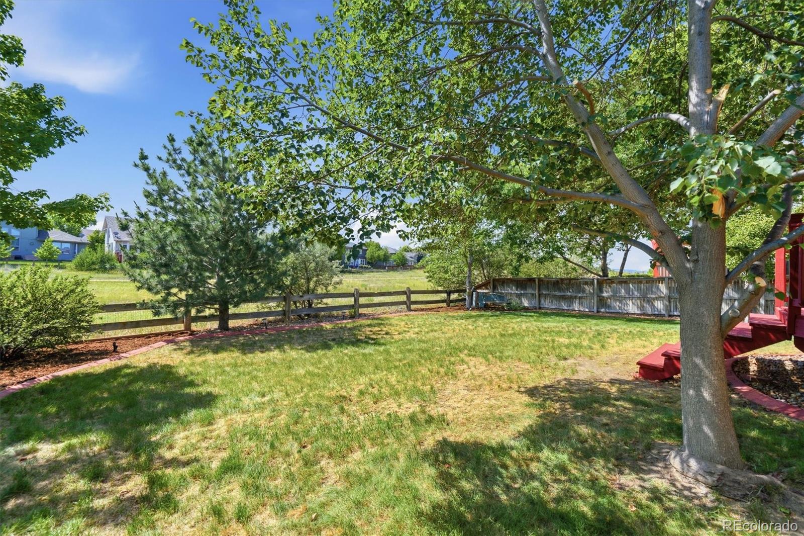 9629 Burberry Way Highlands Ranch, CO 80129 - Photo 41 of 50 a view of backyard with green space