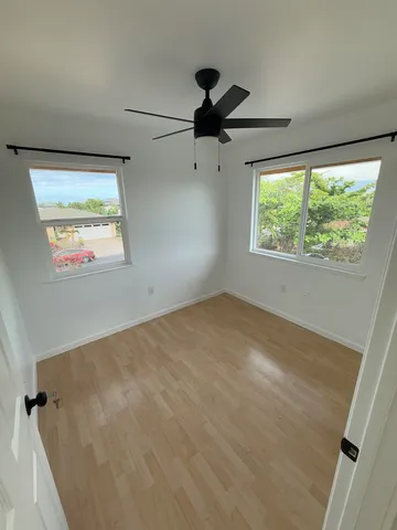 a view of an empty room and a window