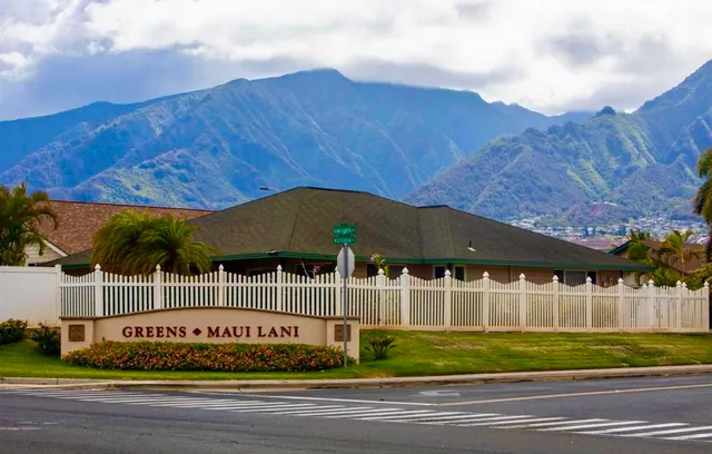 a view of yard with wooden fence