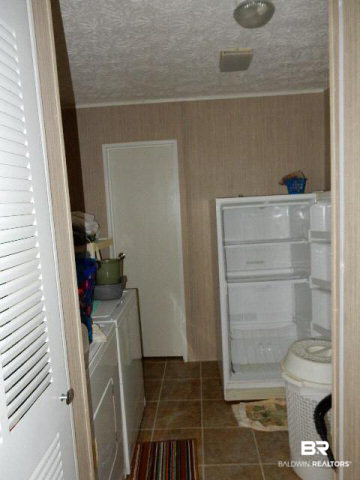 580 Escambia Loop Lillian, AL 36549 - Photo 13 of 16 Large laundry room