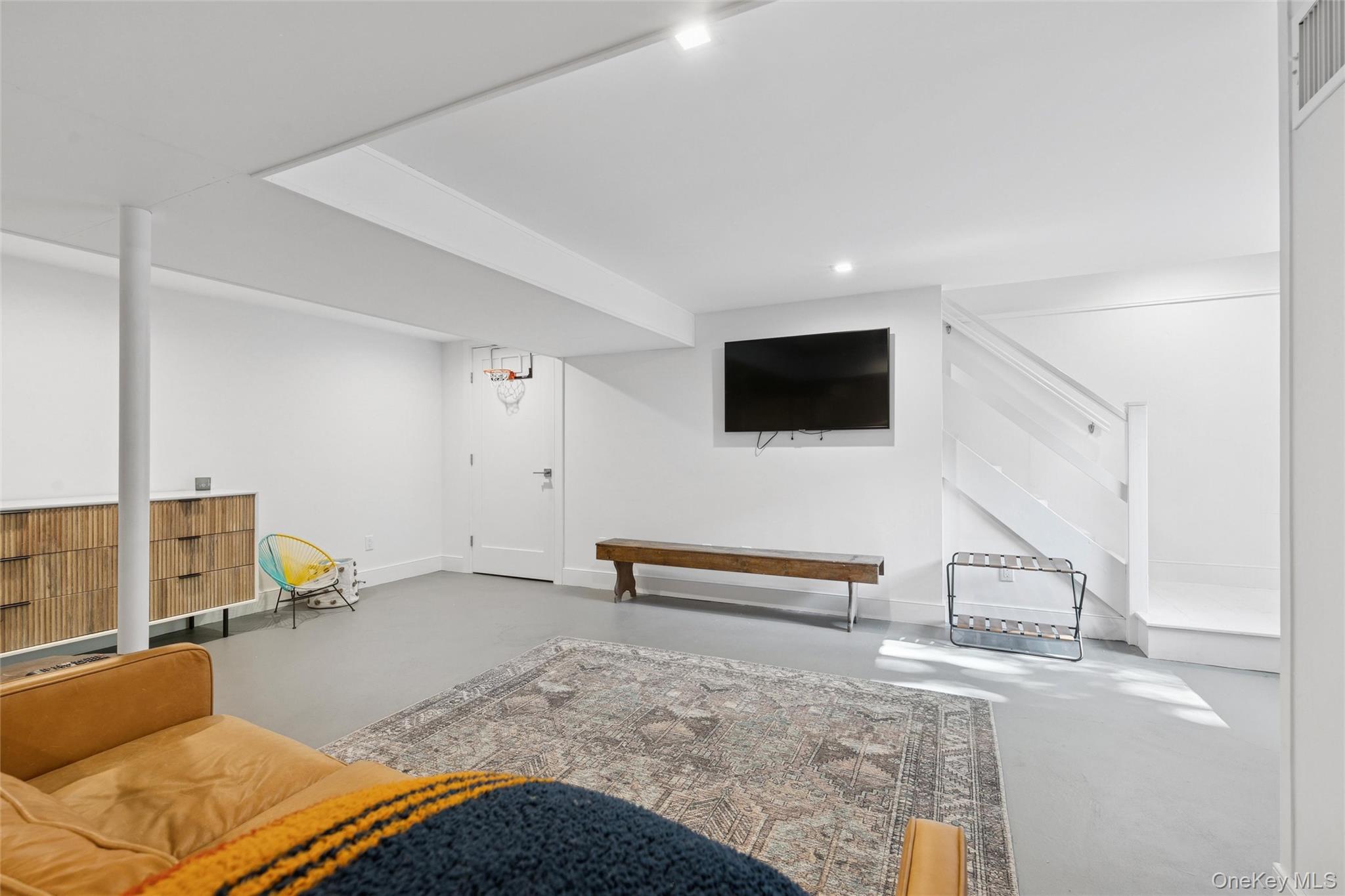 4 Morris Court Westhampton Beach, NY 11978 - Photo 19 of 28 a bedroom with furniture and a flat screen tv