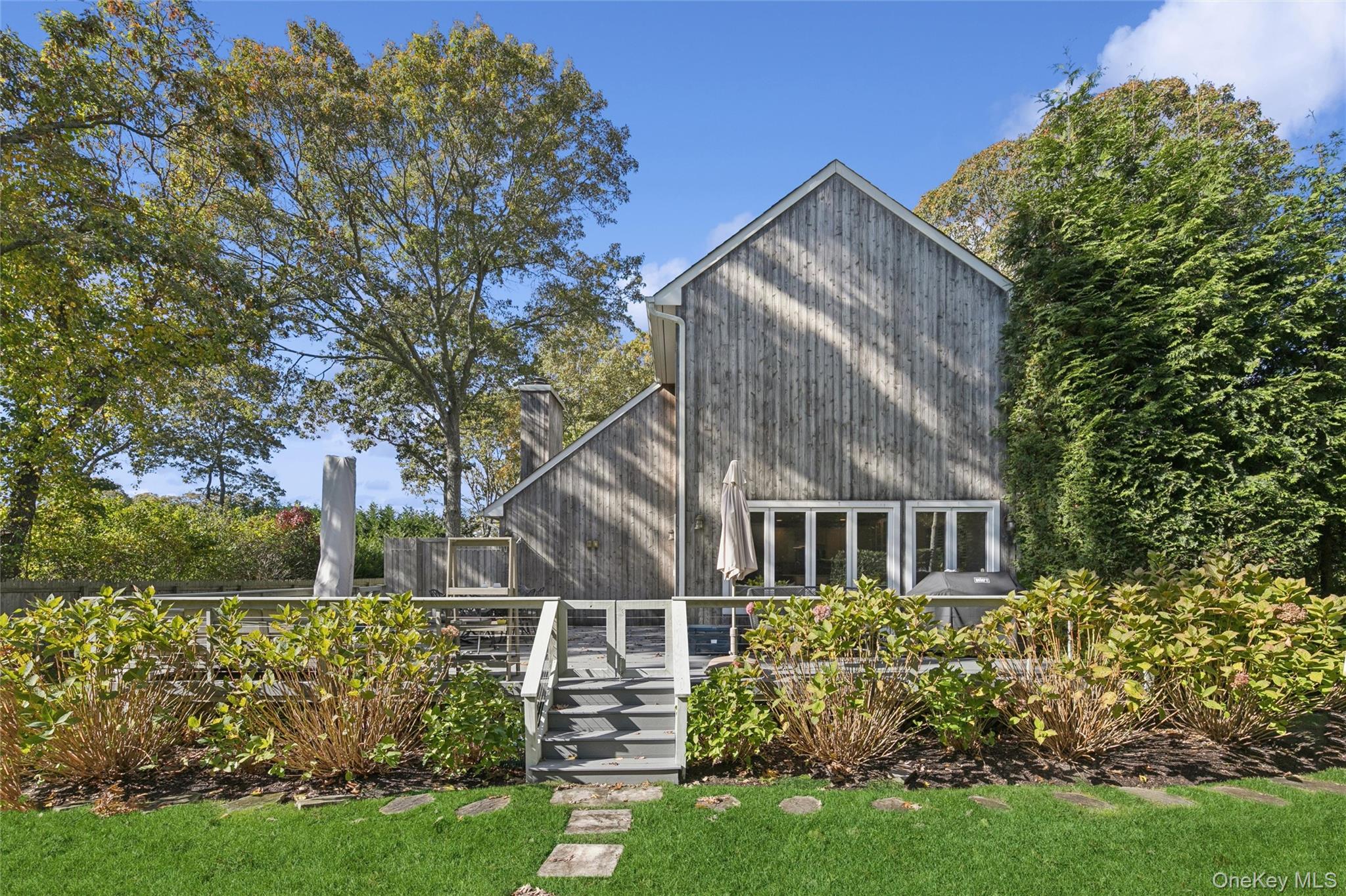 4 Morris Court Westhampton Beach, NY 11978 - Photo 2 of 28 front view of house with a yard