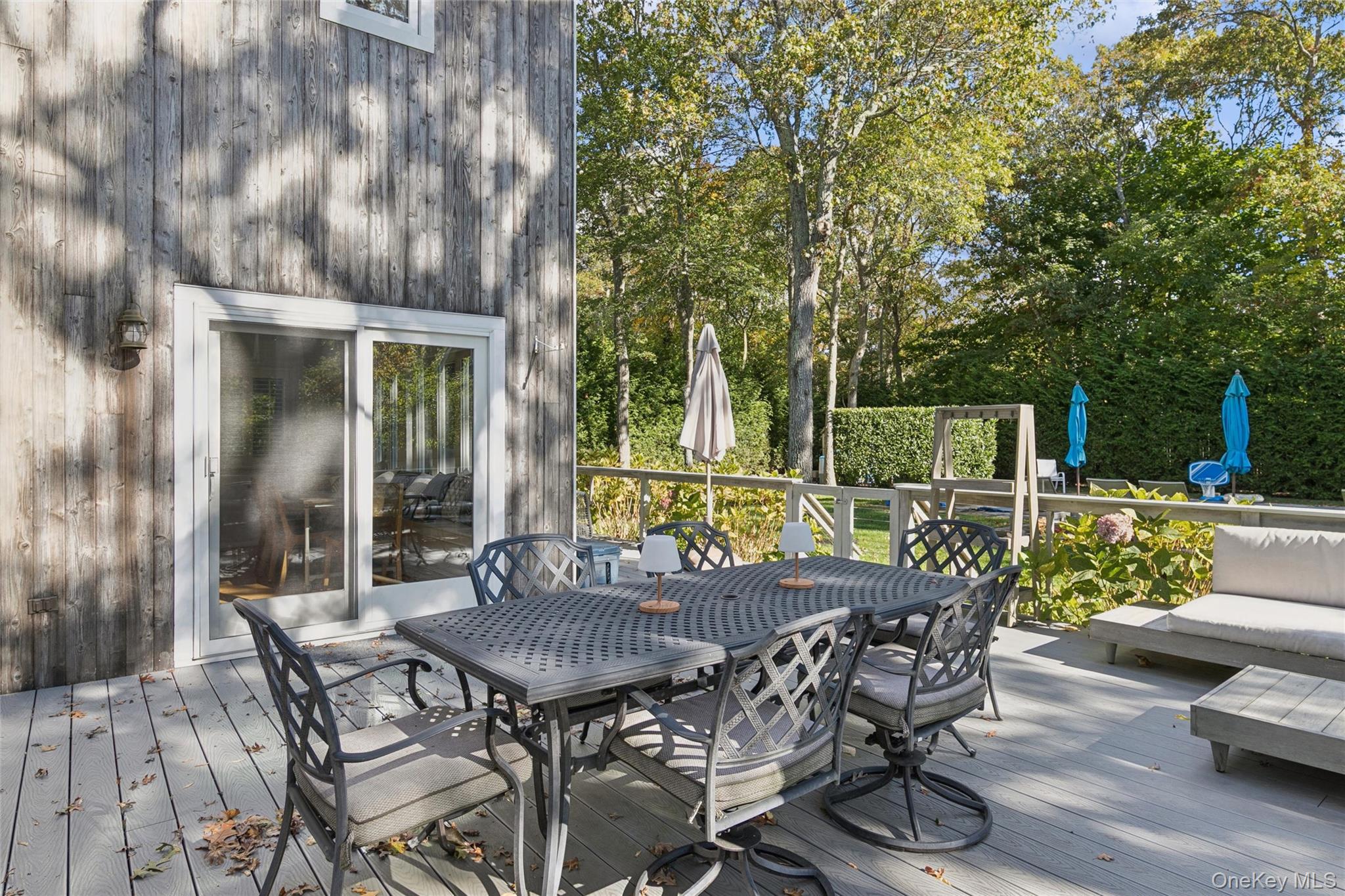 4 Morris Court Westhampton Beach, NY 11978 - Photo 23 of 28 a view of a patio with table and chairs and potted plants