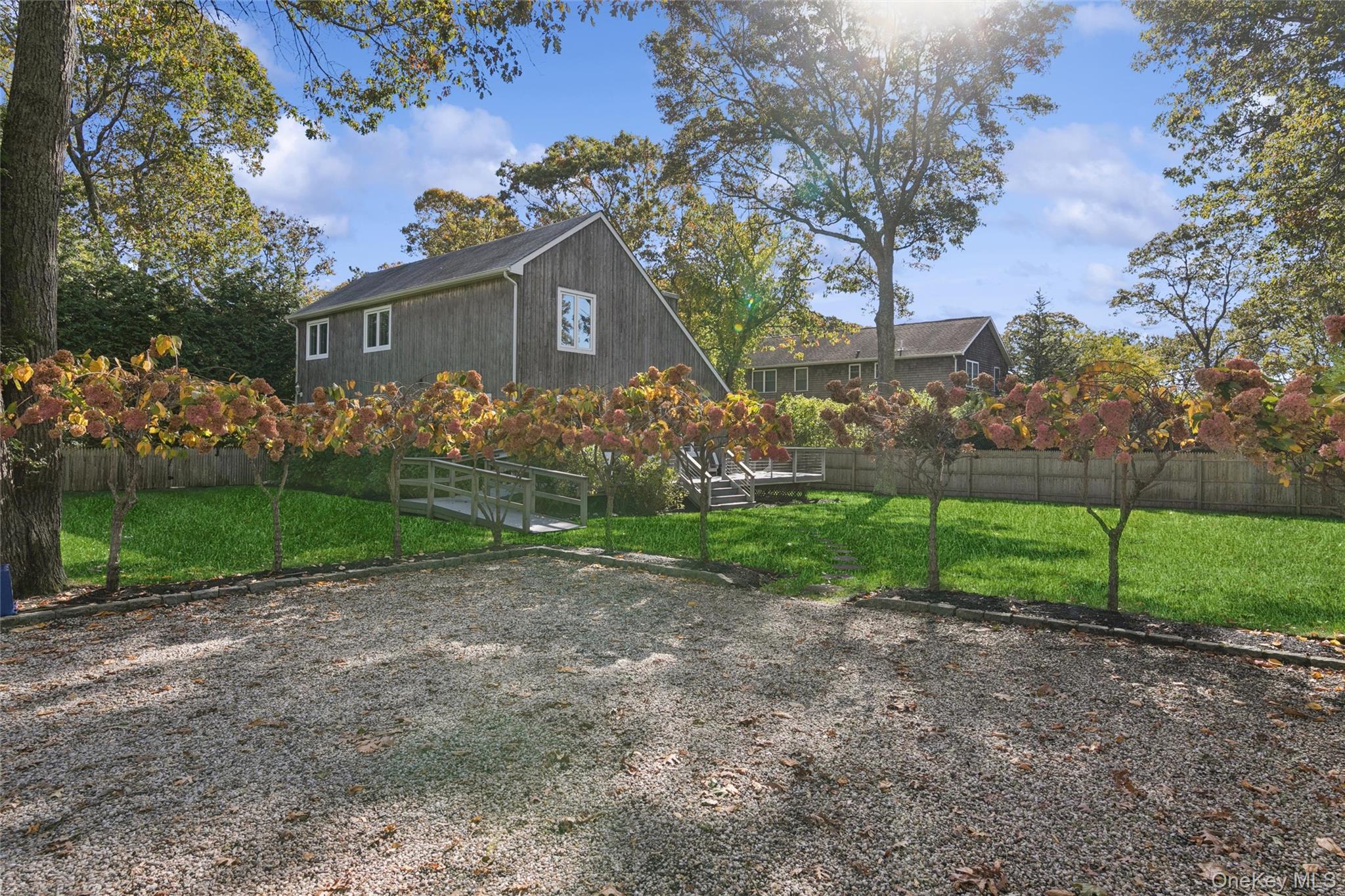 4 Morris Court Westhampton Beach, NY 11978 - Photo 28 of 28 a front view of a house with garden