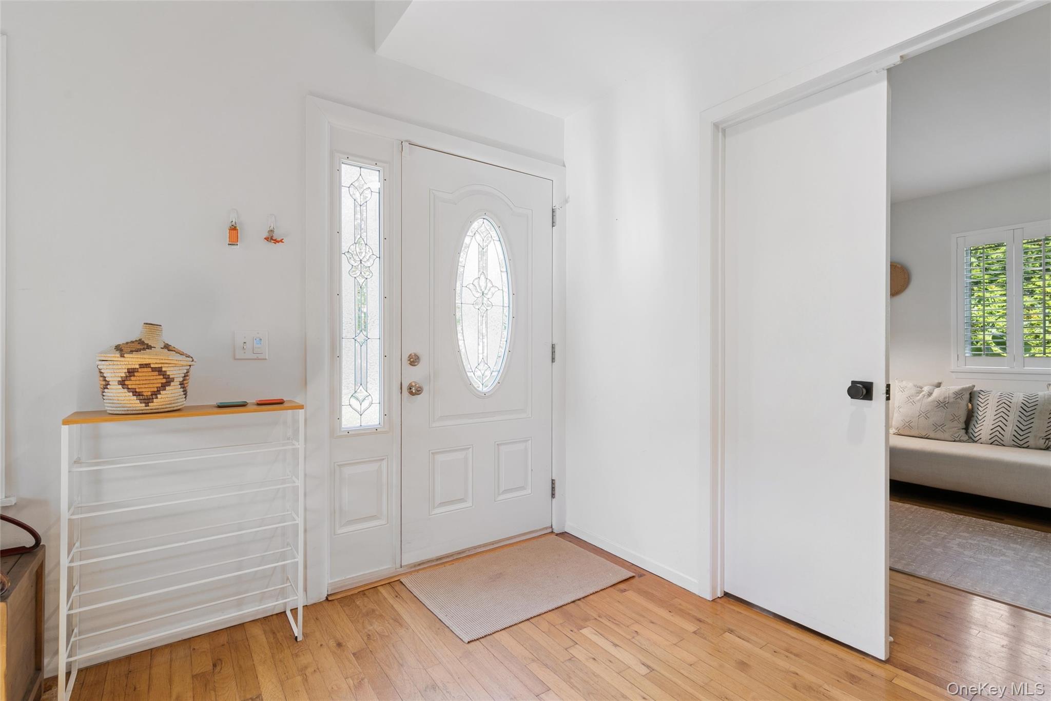 4 Morris Court Westhampton Beach, NY 11978 - Photo 3 of 28 a view of livingroom with hardwood floor and a bathroom