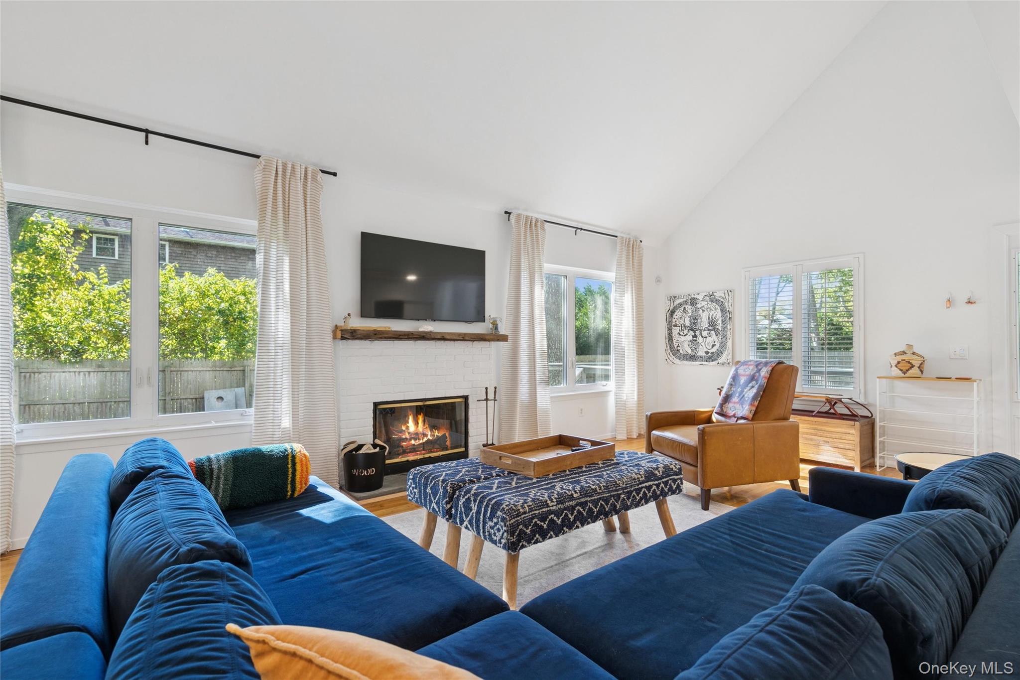 4 Morris Court Westhampton Beach, NY 11978 - Photo 4 of 28 a living room with furniture and a fireplace