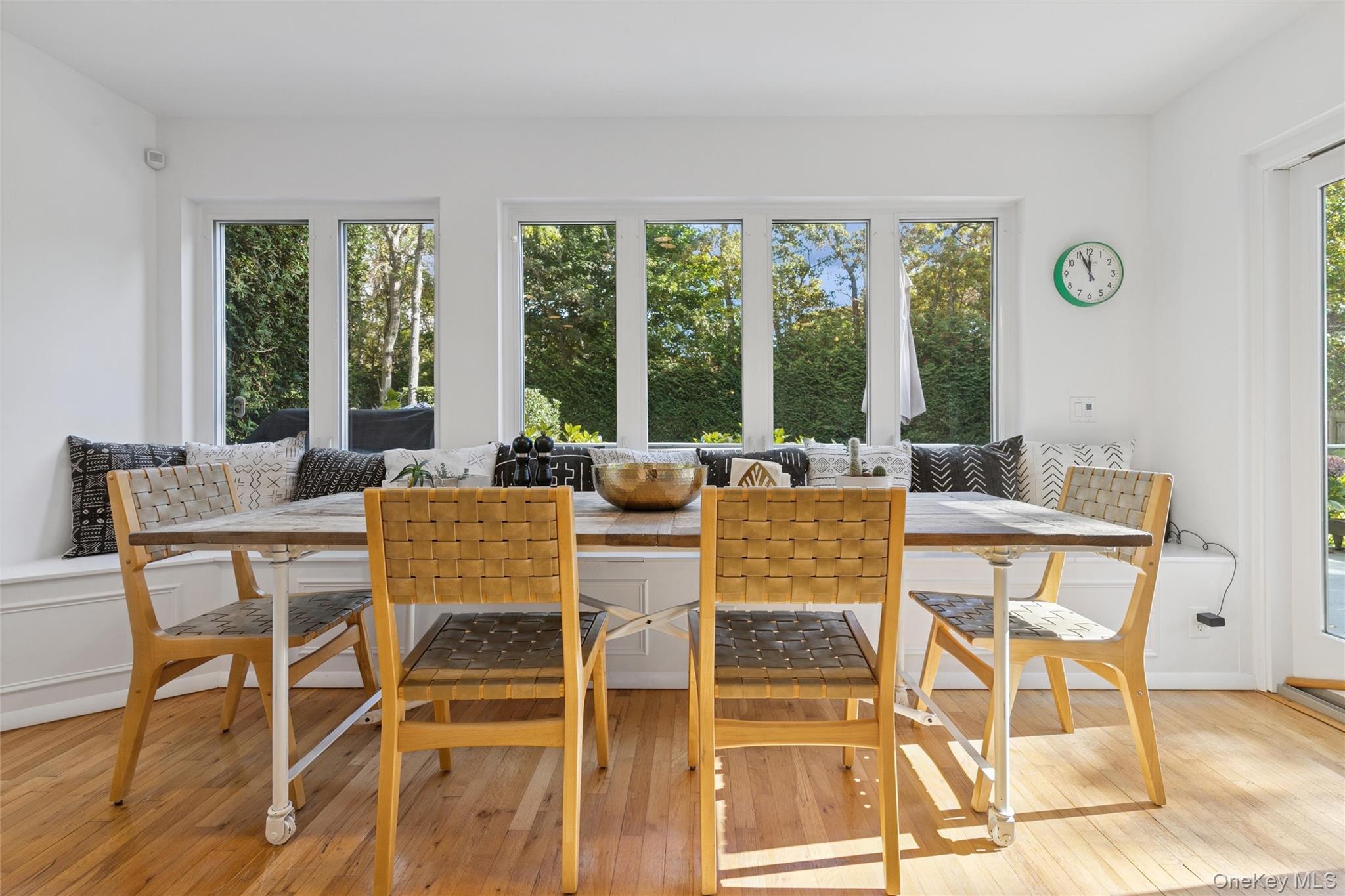 4 Morris Court Westhampton Beach, NY 11978 - Photo 6 of 28 a dining room with furniture and large windows