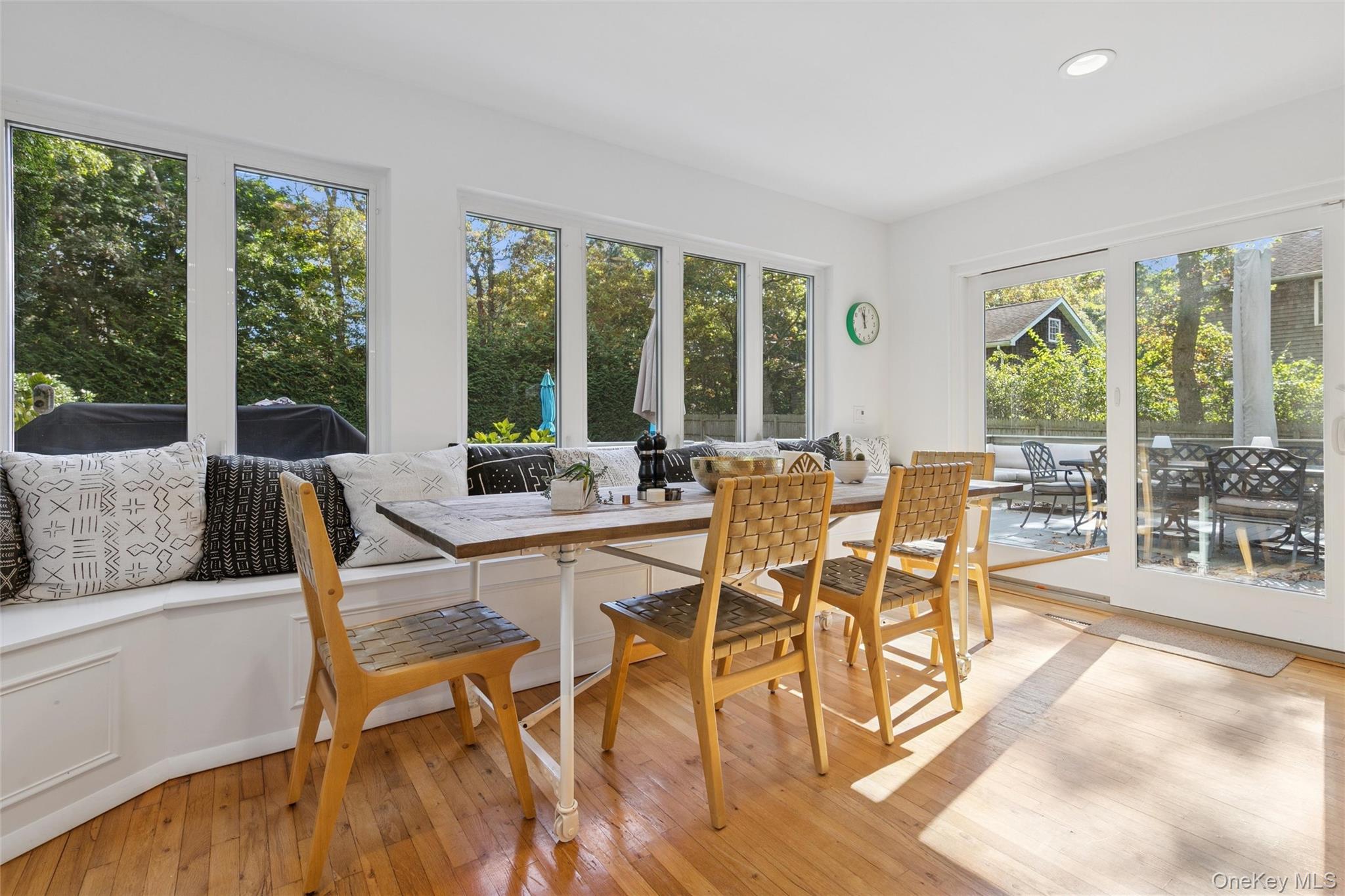 4 Morris Court Westhampton Beach, NY 11978 - Photo 7 of 28 a view of a dining room with furniture large windows and wooden floor