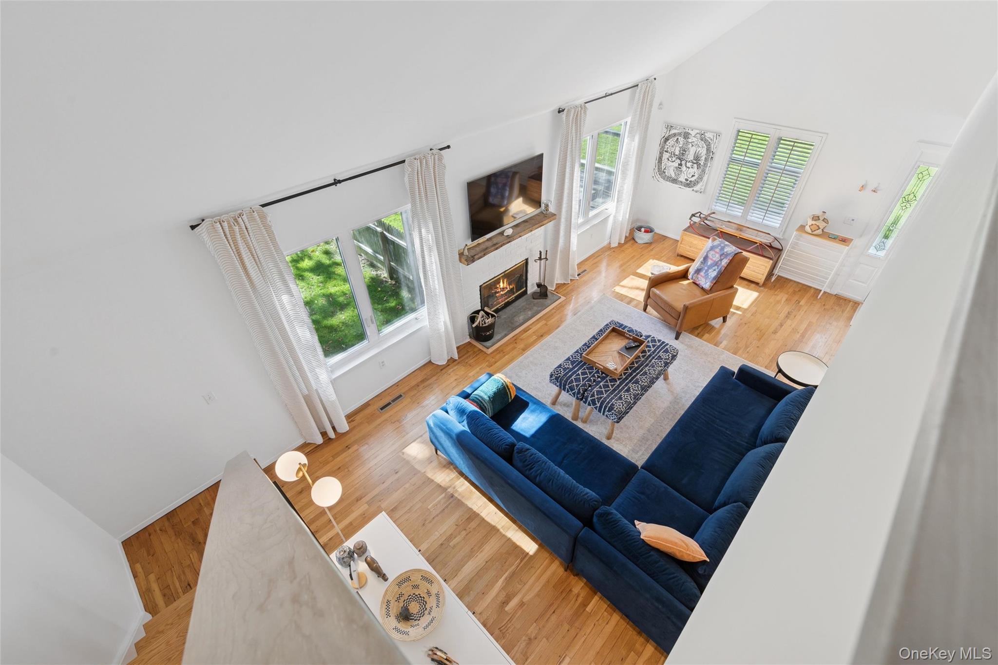 4 Morris Court Westhampton Beach, NY 11978 - Photo 10 of 28 a living room with furniture and a flat screen tv