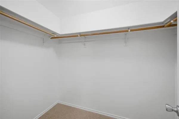 a view of a room with shelf on the wall