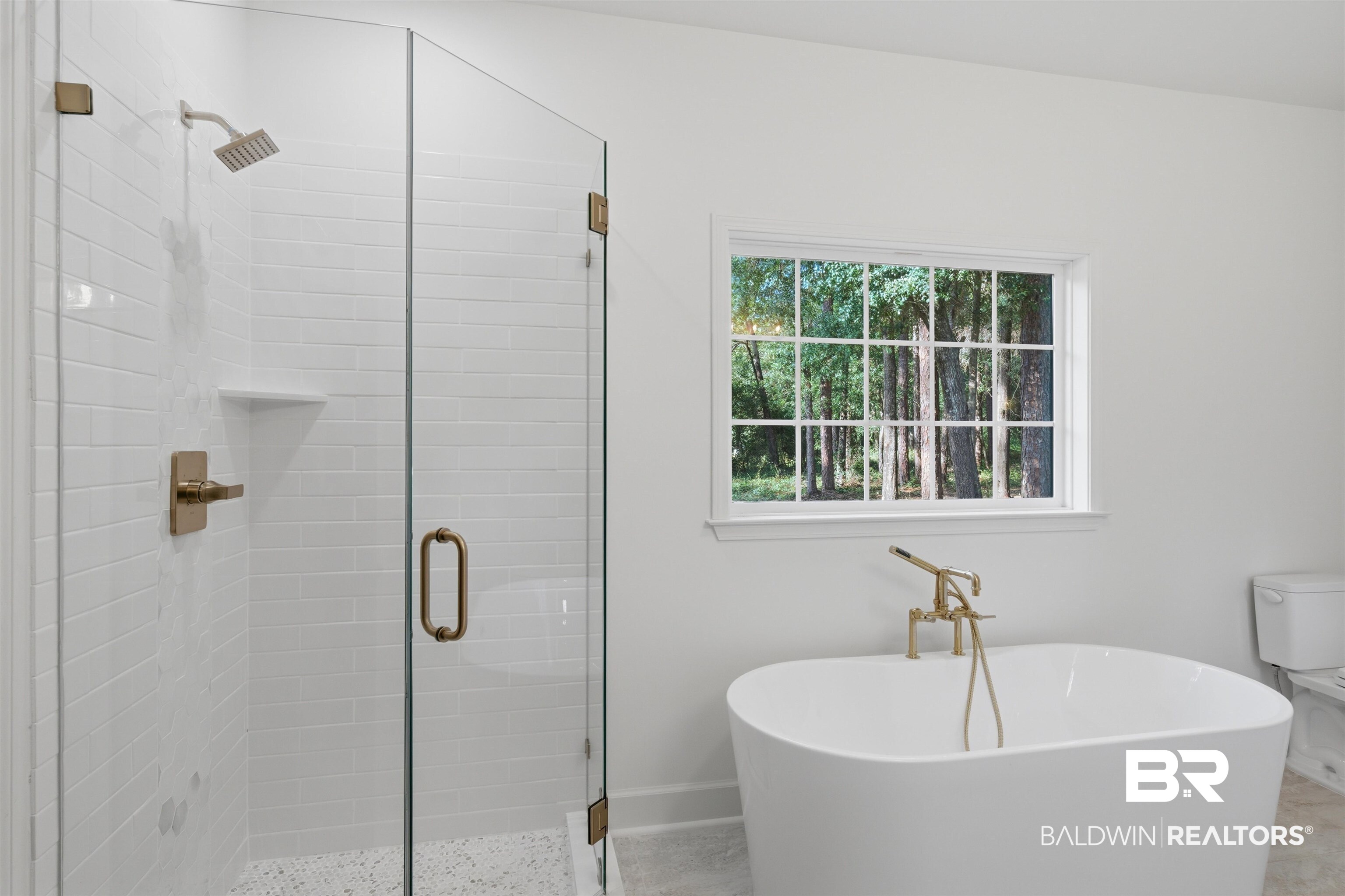 14128 Jackson Lane Foley, AL 36535 - Photo 23 of 36 Freestanding soaking tub with floor-mounted brass faucet