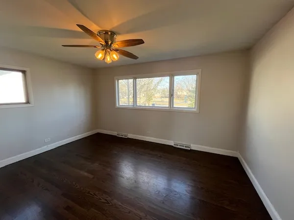 an empty room with a potted plant