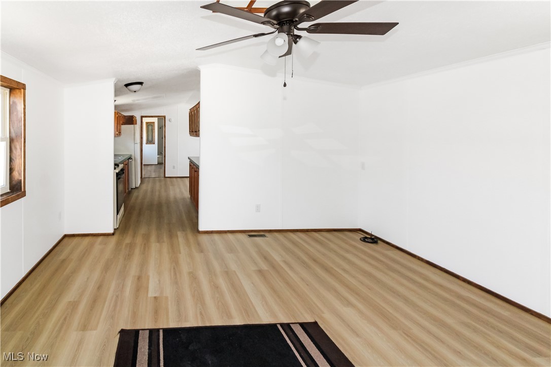 265 Meachem Road, Unit 41 Port Clinton, OH 43452 - Photo 22 of 33 Spare room with a ceiling fan, baseboards, light wood-style flooring, and visible vents