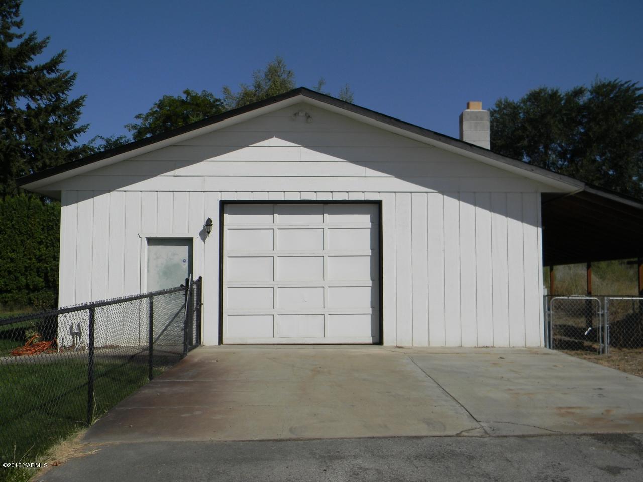 1805 Ekelman Road Yakima, WA 98901 - Photo 16 of 16 a front view of a house with a garage