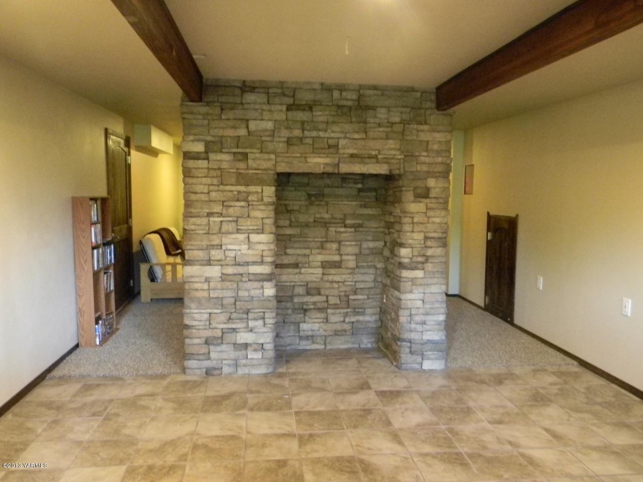 1805 Ekelman Road Yakima, WA 98901 - Photo 10 of 16 a view of water heater room with a brick wall