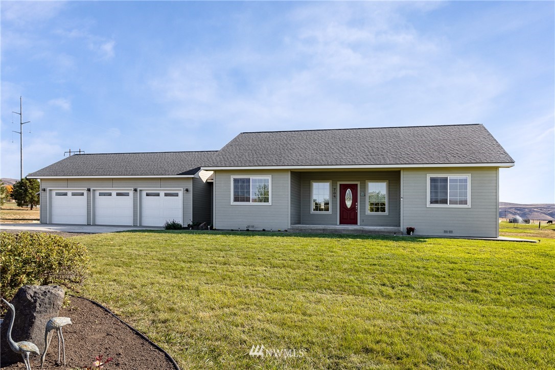 704 Firing Center Road Yakima, WA 98901 - Photo 1 of 29 a view of a house with a yard