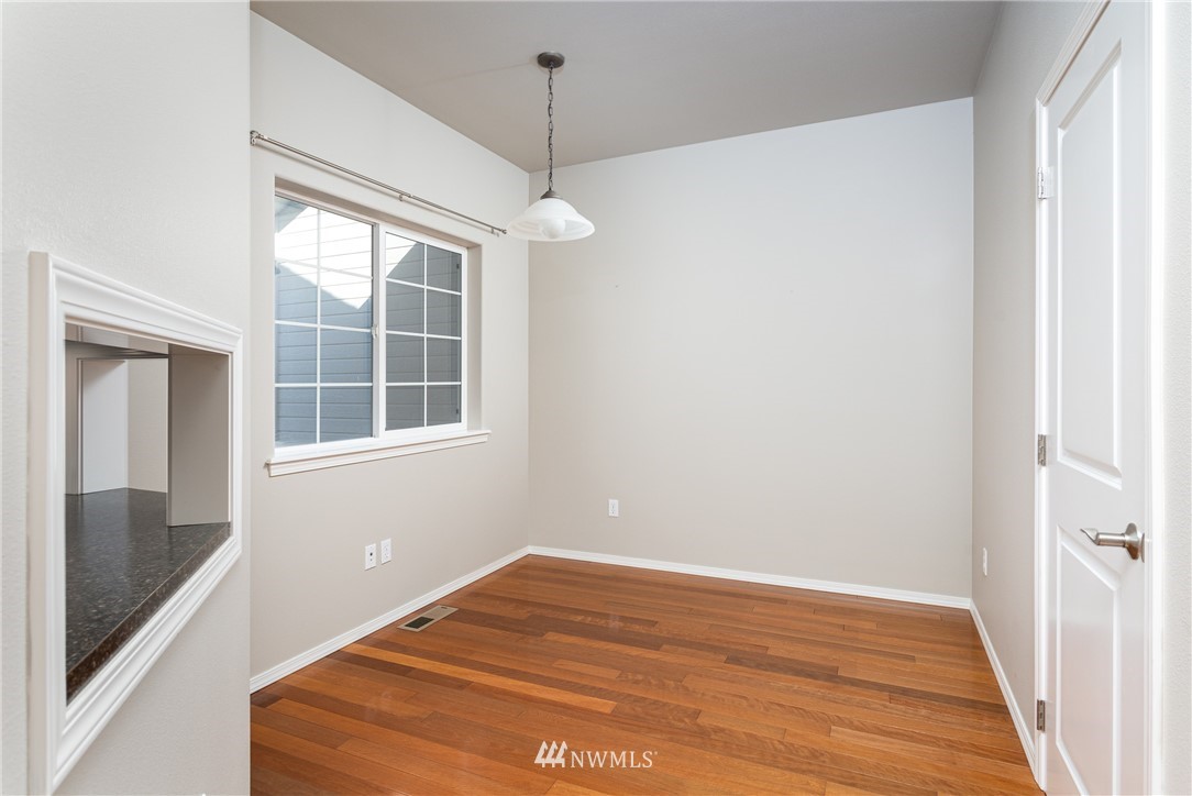 704 Firing Center Road Yakima, WA 98901 - Photo 14 of 29 a view of empty room with wooden floor and fan