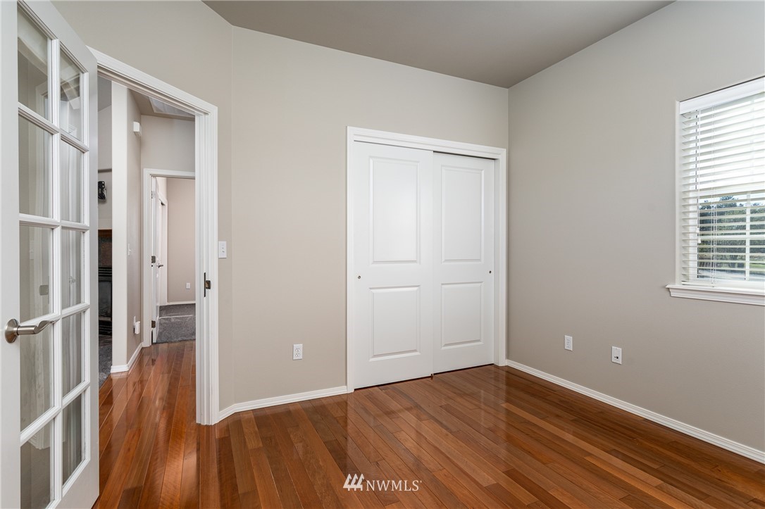 704 Firing Center Road Yakima, WA 98901 - Photo 21 of 29 a view of a room with wooden floor and a window