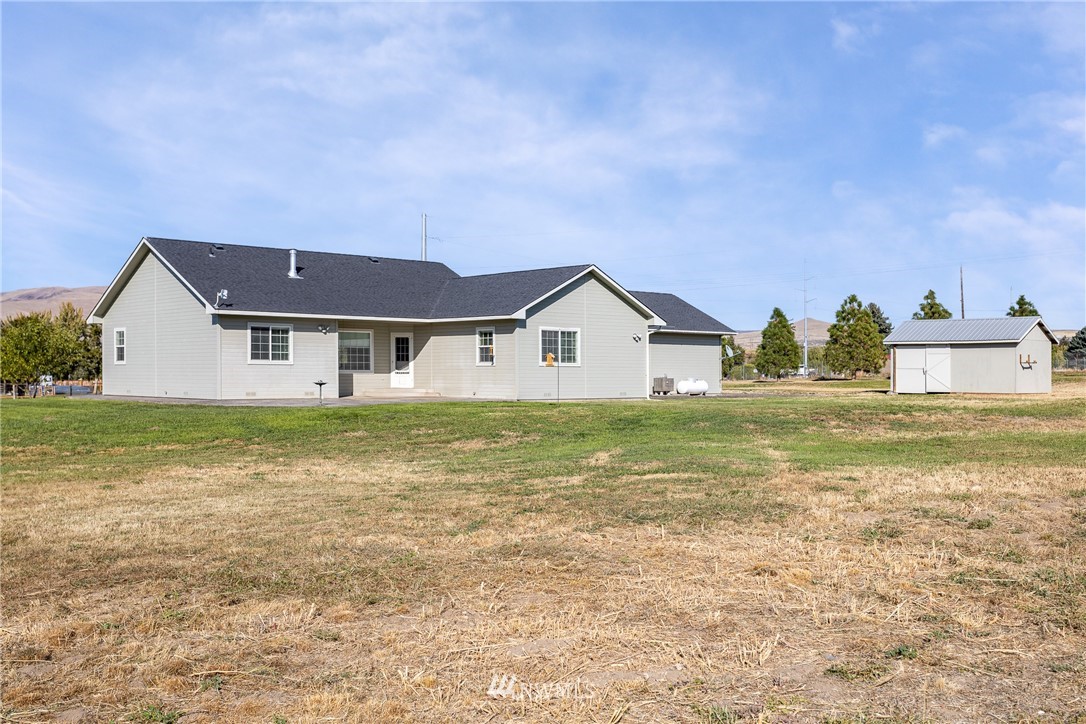 704 Firing Center Road Yakima, WA 98901 - Photo 24 of 29 a front view of a house with a yard