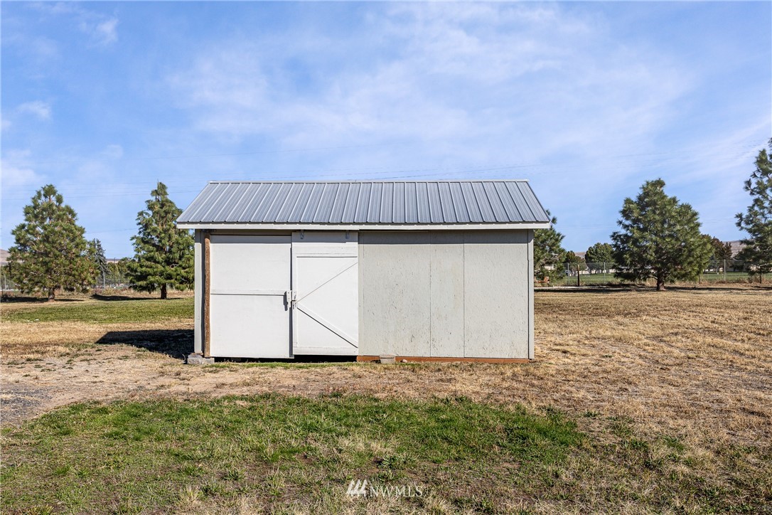 704 Firing Center Road Yakima, WA 98901 - Photo 27 of 29 a view of backyard space and hardwood