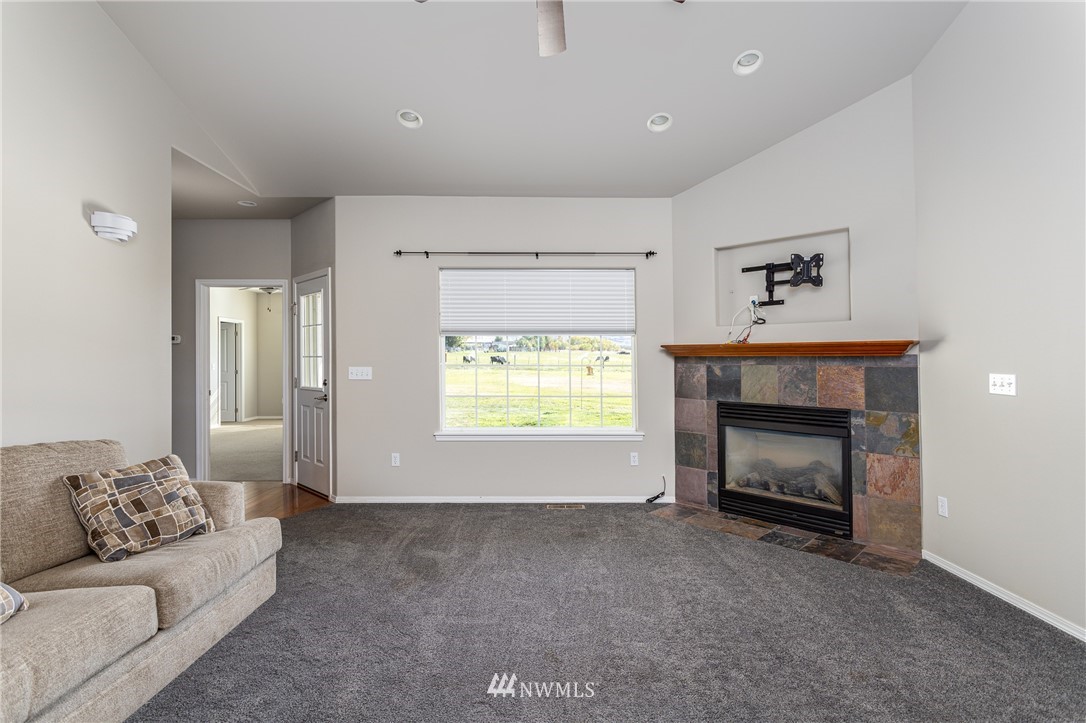704 Firing Center Road Yakima, WA 98901 - Photo 8 of 29 a living room with furniture and a fireplace