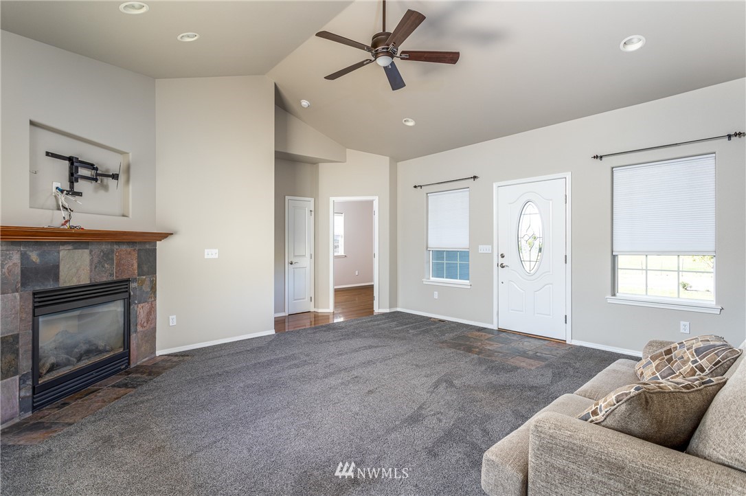 704 Firing Center Road Yakima, WA 98901 - Photo 10 of 29 a living room with furniture and a fireplace