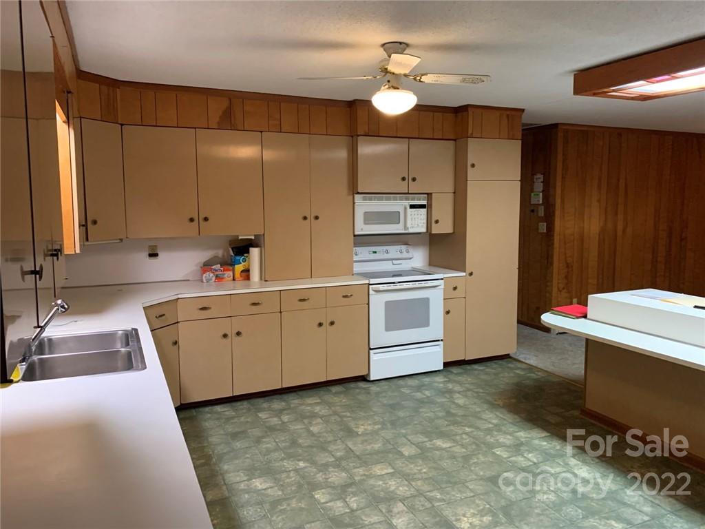 3170 Spring Garden Road, Unit 112 Claremont, NC 28610 - Photo 11 of 36 a room with a washing machine and sink
