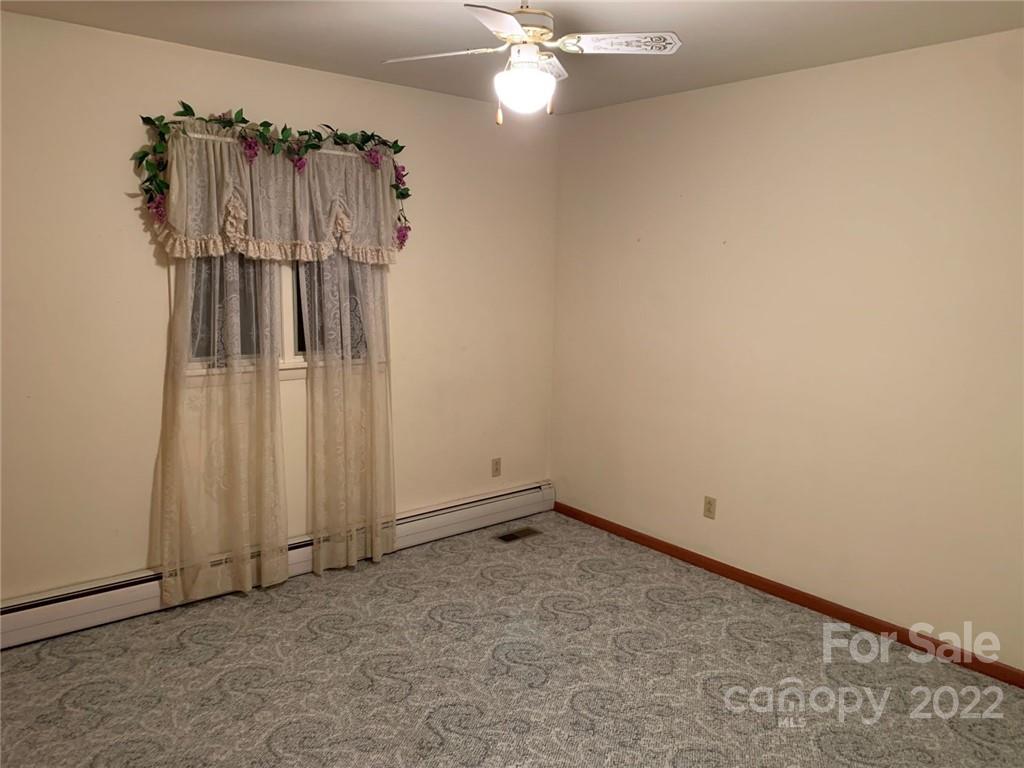 3170 Spring Garden Road, Unit 112 Claremont, NC 28610 - Photo 22 of 36 a view of a room with stairs