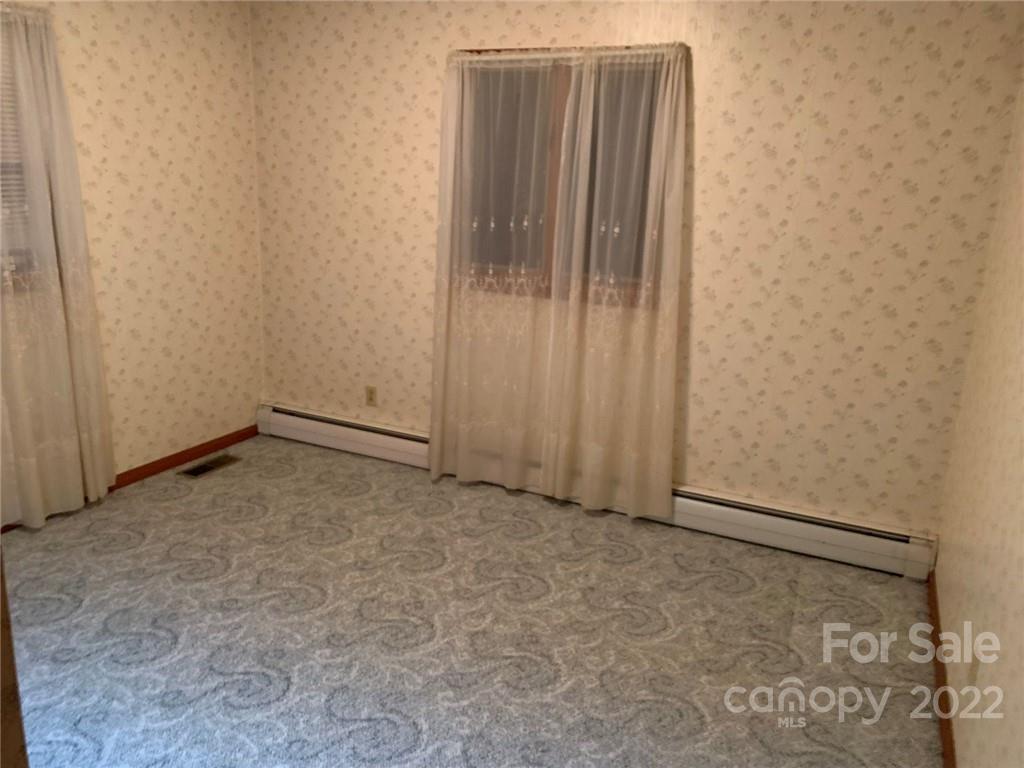 3170 Spring Garden Road, Unit 112 Claremont, NC 28610 - Photo 23 of 36 a view of an empty room