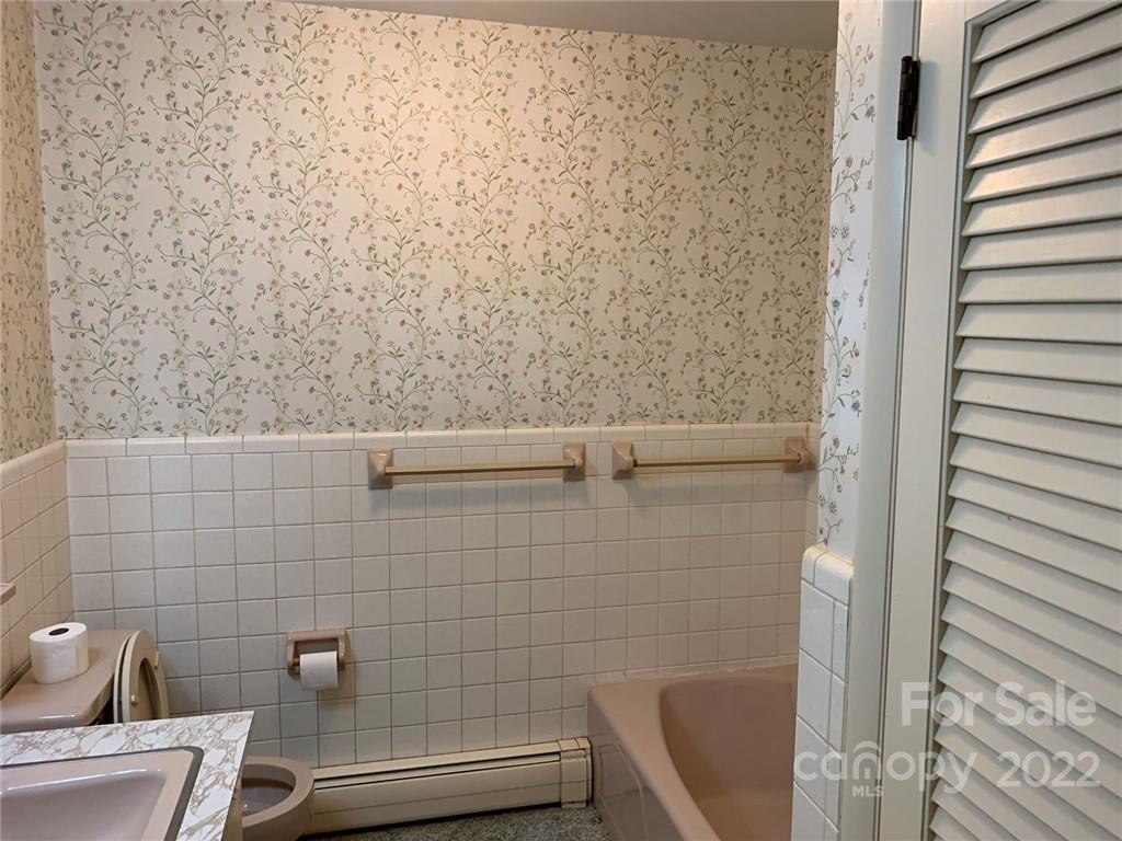 3170 Spring Garden Road, Unit 112 Claremont, NC 28610 - Photo 25 of 36 a bathroom with a sink and a toilet