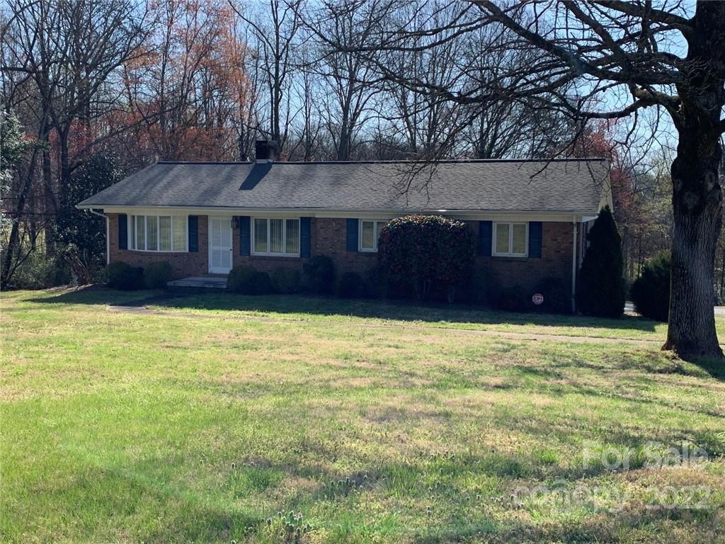 3170 Spring Garden Road, Unit 112 Claremont, NC 28610 - Photo 3 of 36 front view of a house with a yard
