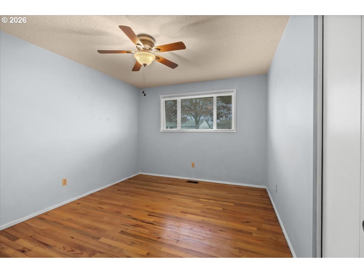 1386 Umpqua Road Woodburn, OR 97071 - Photo 18 of 32 a view of an empty room with a window