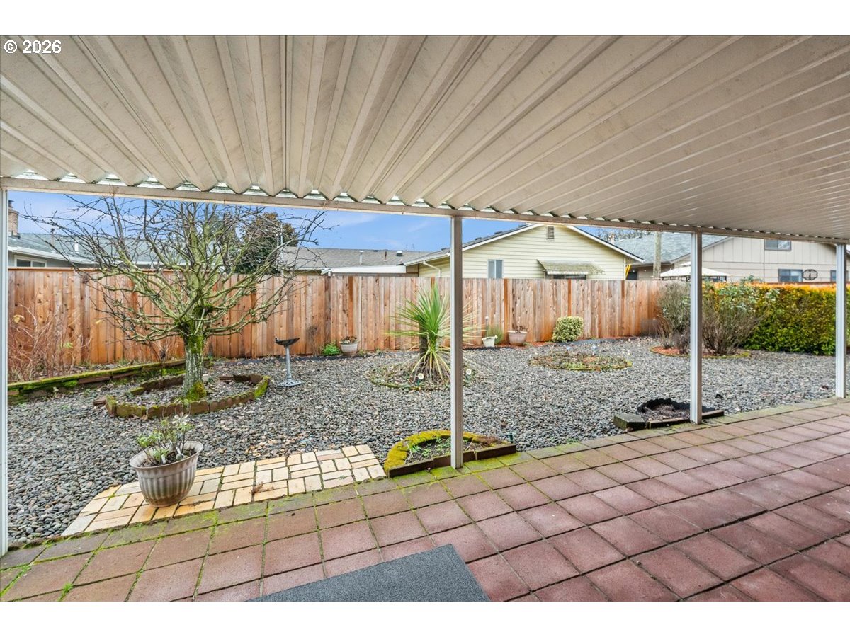 1386 Umpqua Road Woodburn, OR 97071 - Photo 24 of 32 a view of a house with backyard and chairs