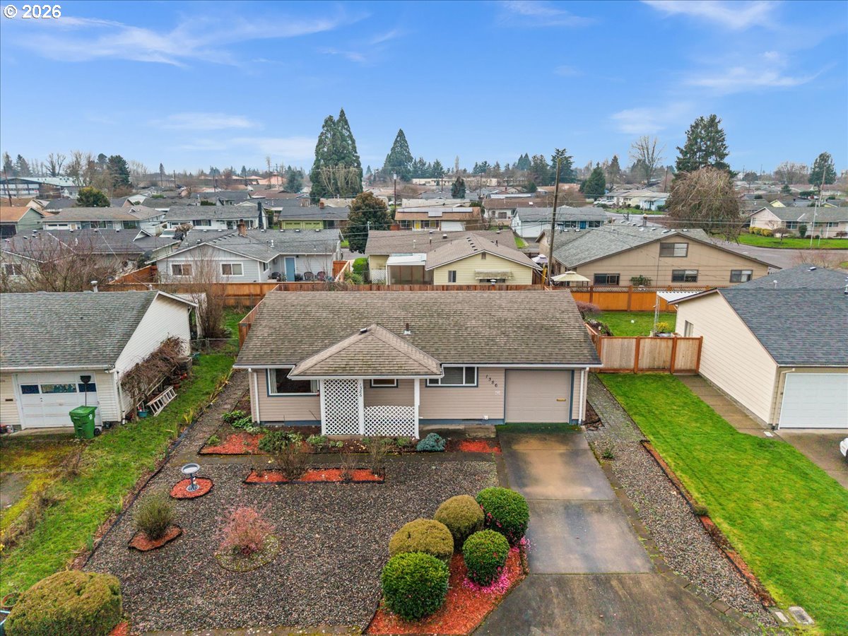 1386 Umpqua Road Woodburn, OR 97071 - Photo 29 of 32 a view of a house with a garden space