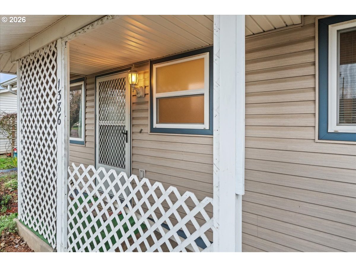 1386 Umpqua Road Woodburn, OR 97071 - Photo 3 of 32 a view of a house with a door